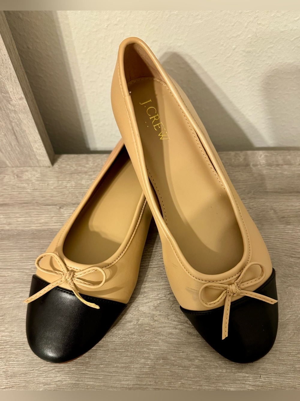 J.Crew cap-toe ballet flats, size 7. This is a classic two-tone style featuring